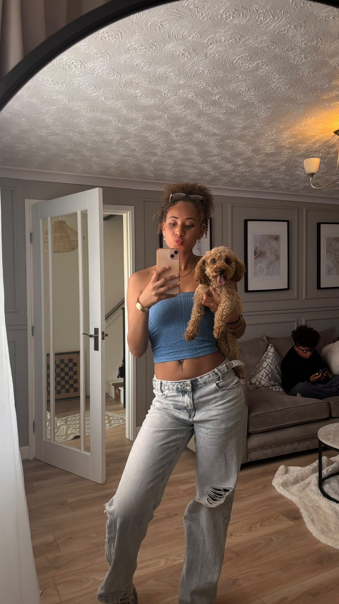 Lytoya Ri posing at home with her dog